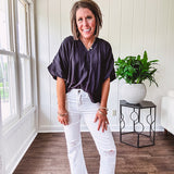 Lightweight, flowy V neck blouse with mock neck and puff short sleeves.