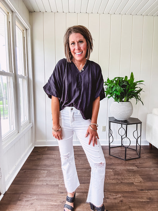Lightweight, flowy V neck blouse with mock neck and puff short sleeves.