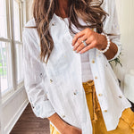 Thin, lightweight long sleeved button down blouse featuring white and blue or olive stripes adorned with small pastel floral embroidery throughout.