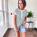 Cream and hunter green striped Henley tee shirt with 5 silver snap buttons on the front and U shaped hem.