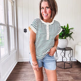 Cream and hunter green striped Henley tee shirt with 5 silver snap buttons on the front and U shaped hem.