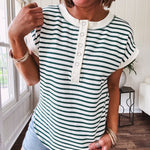 Cream and hunter green striped Henley tee shirt with 5 silver snap buttons on the front and U shaped hem.