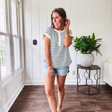 Cream and hunter green striped Henley tee shirt with 5 silver snap buttons on the front and U shaped hem.