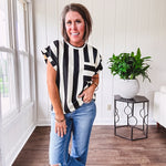 Soft, lightweight black and ivory color block striped tee with cuffed sleeves and front pocket.