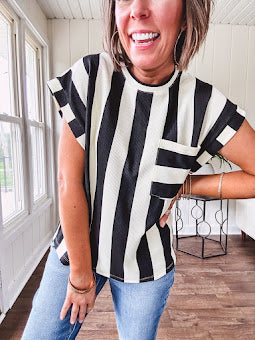 Soft, lightweight black and ivory color block striped tee with cuffed sleeves and front pocket.