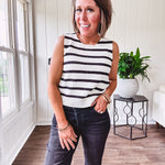 Soft black and white striped knit sweater vest with round neck and black bow ties at the back.
