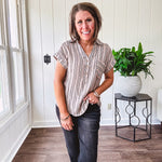 Soft, lightweight mocha and black striped collared shirt with V neck and 3 faux wooden buttons on the front, front pocket and cuffed sleeves.