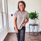 Soft, lightweight mocha and black striped collared shirt with V neck and 3 faux wooden buttons on the front, front pocket and cuffed sleeves.