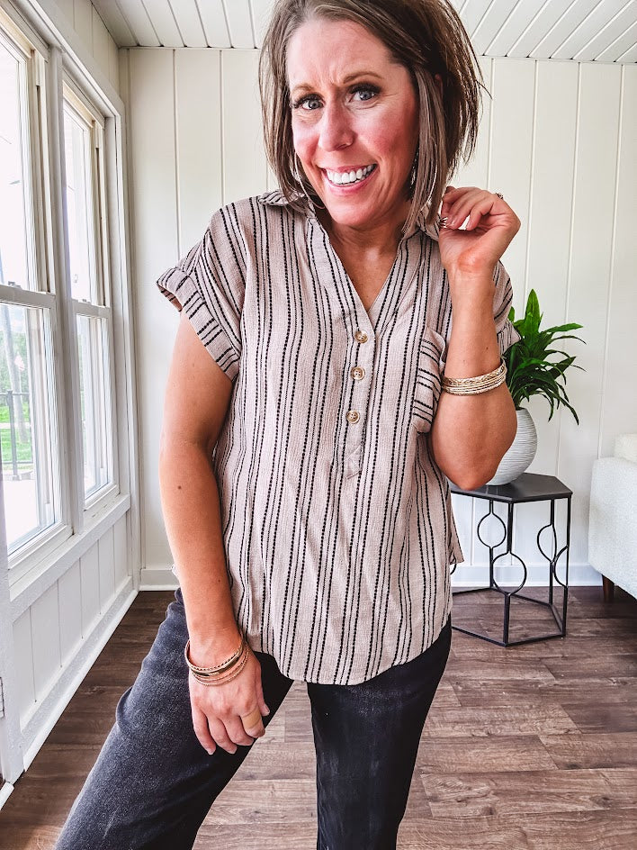 Soft, lightweight mocha and black striped collared shirt with V neck and 3 faux wooden buttons on the front, front pocket and cuffed sleeves.