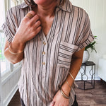 Soft, lightweight mocha and black striped collared shirt with V neck and 3 faux wooden buttons on the front, front pocket and cuffed sleeves.