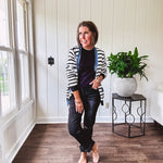 Soft black round neck sweater tank with faux grey layering trim at the neck and hem.