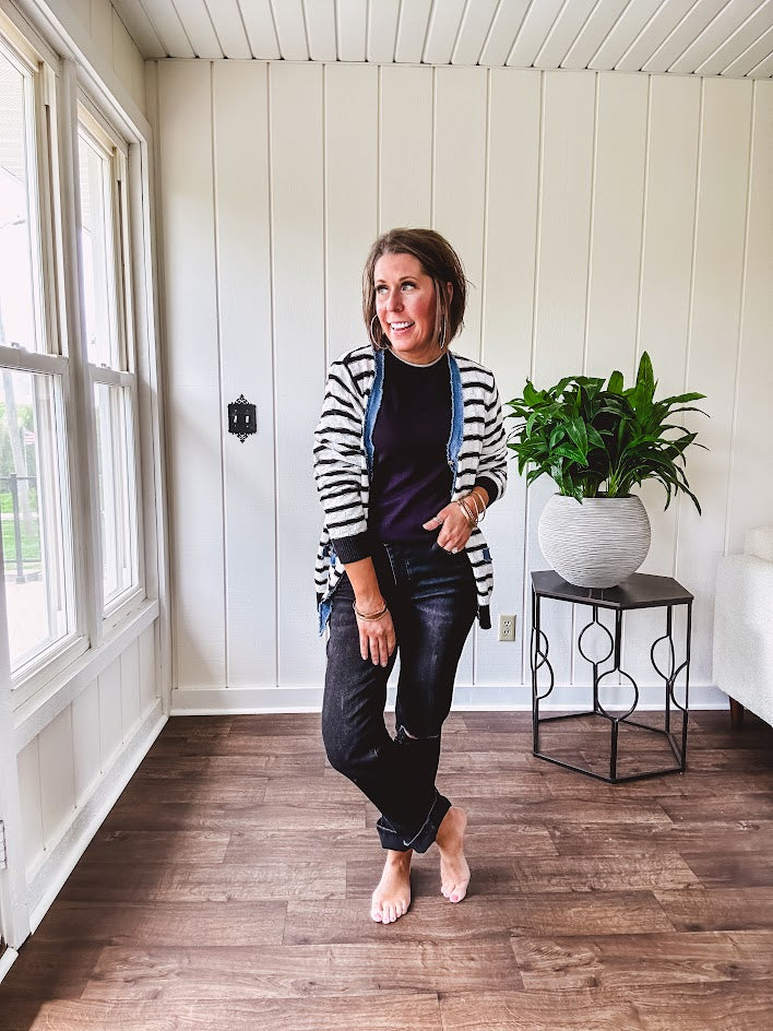 Soft black round neck sweater tank with faux grey layering trim at the neck and hem.