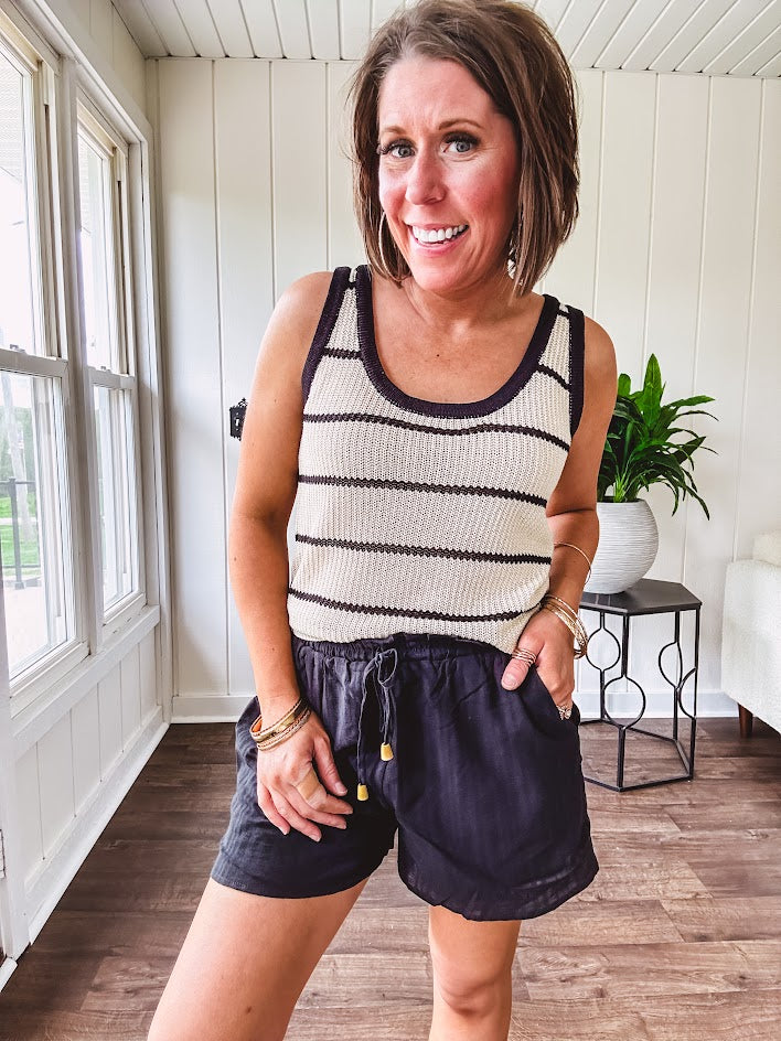 Soft, crocheted oatmeal and black striped round neck tank with black trim.