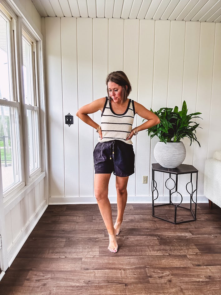 Soft, crocheted oatmeal and black striped round neck tank with black trim.