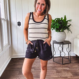 Soft, crocheted oatmeal and black striped round neck tank with black trim.