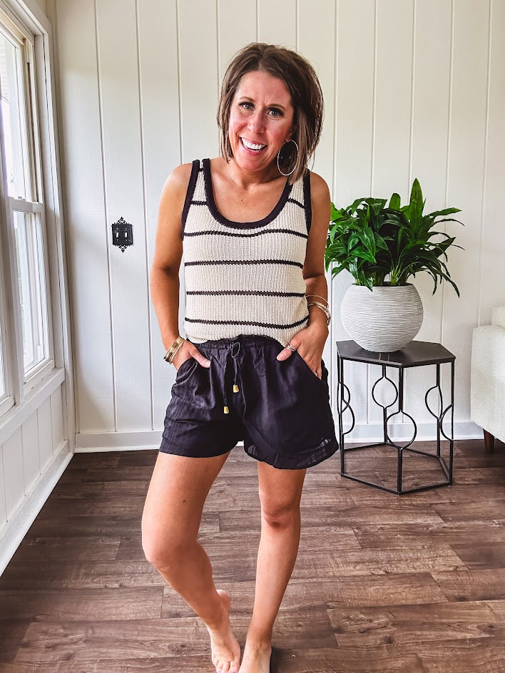 Soft, crocheted oatmeal and black striped round neck tank with black trim.