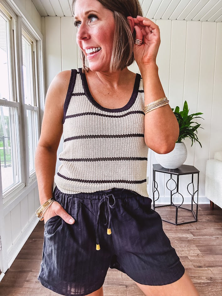 Soft, crocheted oatmeal and black striped round neck tank with black trim.