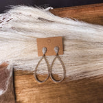 Gold teardrop hoops and teardrop base with pave inlay throughout on a post back