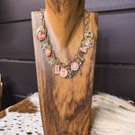 Gold chain link necklace with pink and gold western charms