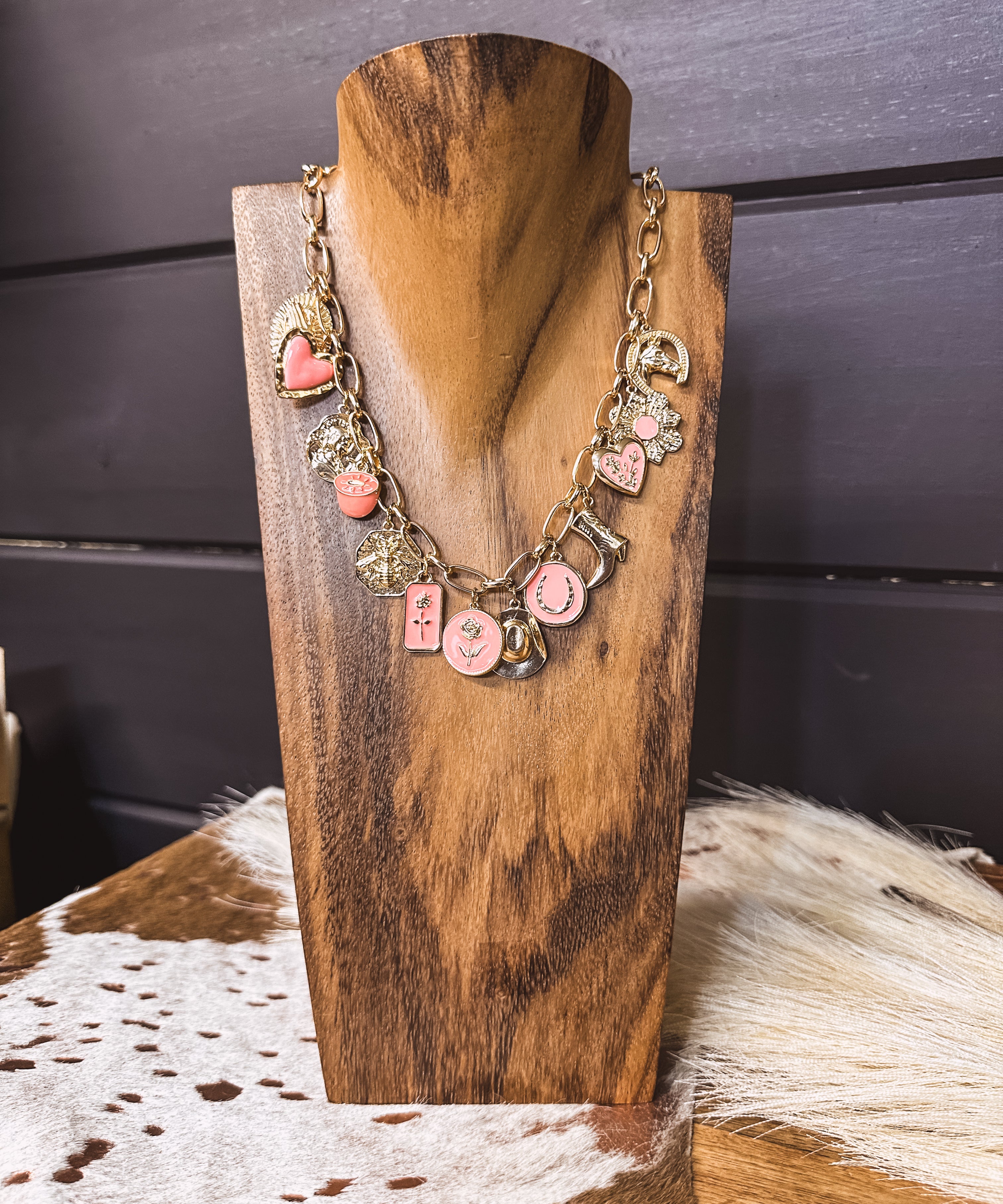 Gold chain link necklace with pink and gold western charms