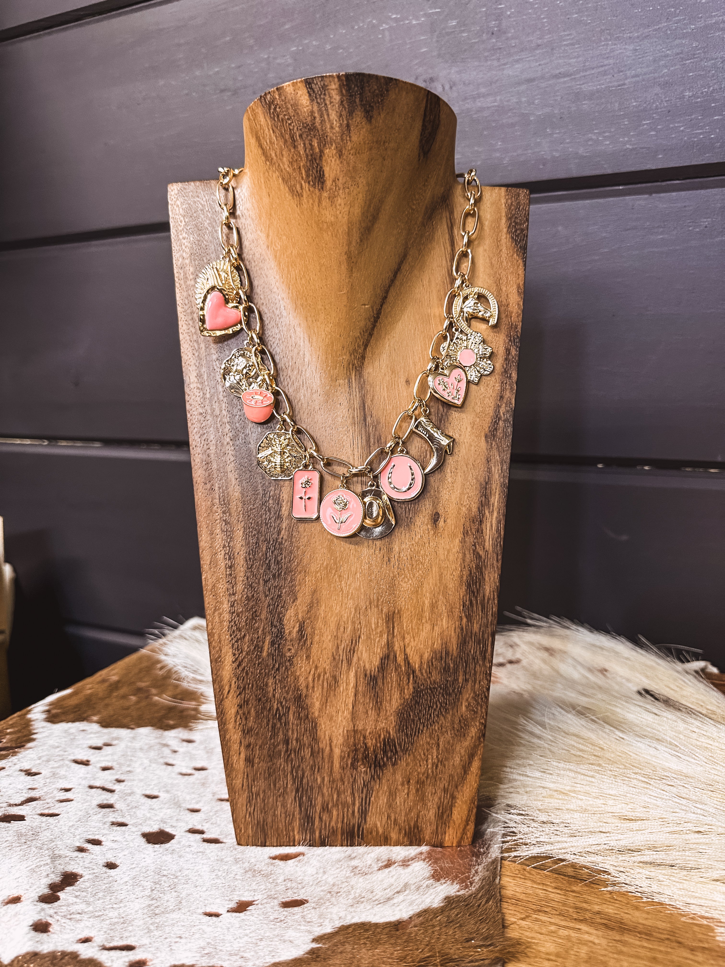 Gold chain link necklace with pink and gold western charms
