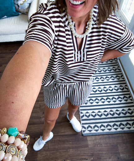 Lightweight terry-like textured fabric in cream and dark brown stripes with V neck, short sleeves and matching elastic waist shorts with pockets.