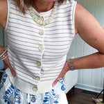 Ivory and taupe striped button down sweater vest with faux wood buttons.
