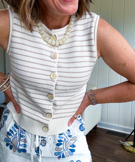 Ivory and taupe striped button down sweater vest with faux wood buttons.