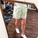 White relaxed fit V neck tee with ribbed texture and round hem.