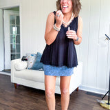 Soft knit denim blue skort with shorts lining, elastic waist and pockets with paisley print throughout.