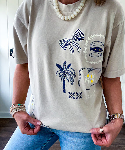 Taupe cotton tee with navy, yellow and white ocean-inspired graphics.
