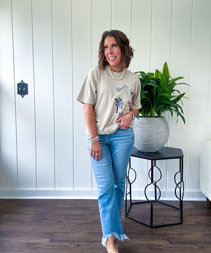 Taupe cotton tee with navy, yellow and white ocean-inspired graphics.
