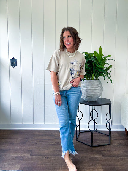 Taupe cotton tee with navy, yellow and white ocean-inspired graphics.