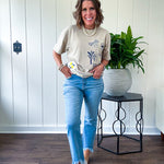 Taupe cotton tee with navy, yellow and white ocean-inspired graphics.