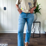Light wash bootcut denim with fray hem, stretch and no distressing.