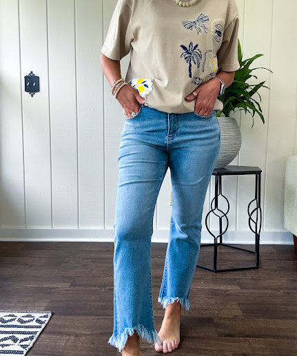 Light wash bootcut denim with fray hem, stretch and no distressing.