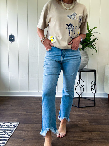 Light wash bootcut denim with fray hem, stretch and no distressing.