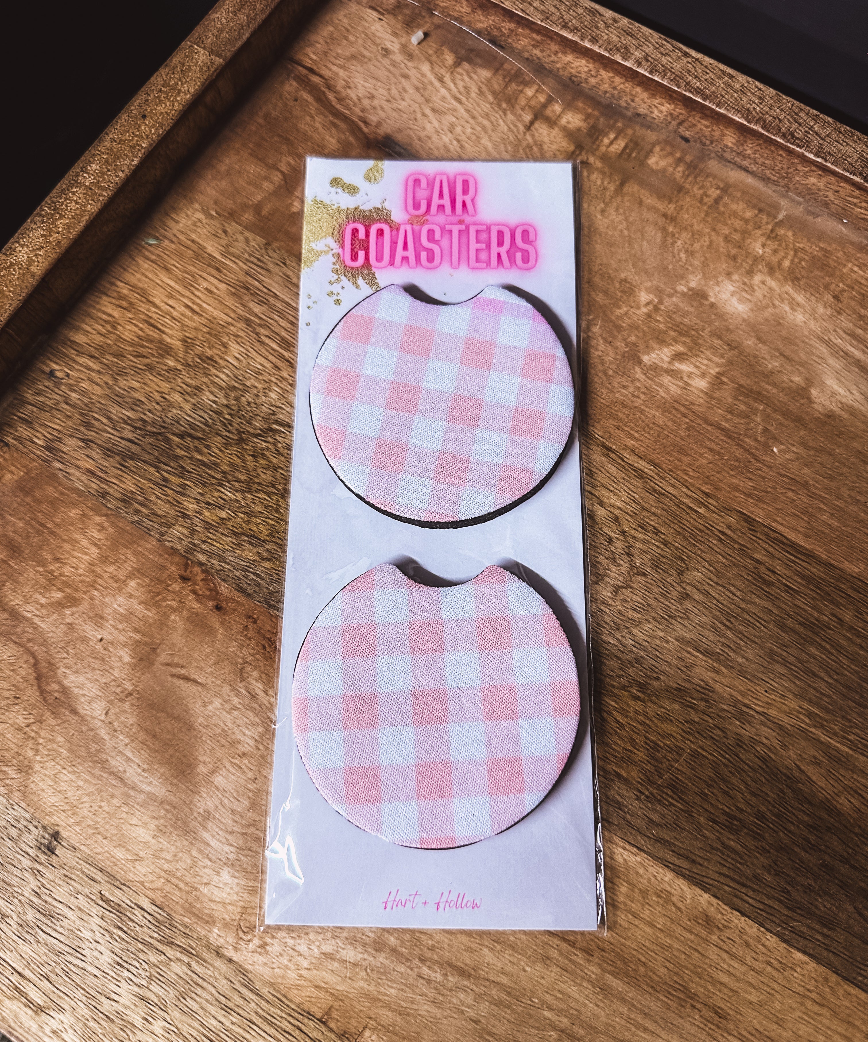 Two pink gingham neoprene car coasters