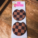 Two black and brown checkered neoprene car coasters.