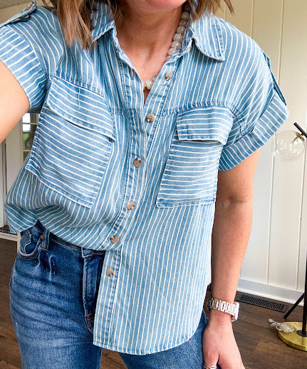 Light chambray button down top with white stripe detail, tab sleeves and front pockets.