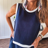 Buttery soft navy wide strap tank in cool navy with white trim at the round neck, sleeves and split hem with a button up back in matching white trim.