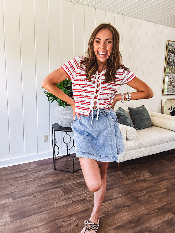 Soft crochet knit red, white and light blue striped short sleeved tie front sweater.