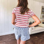 Thin, light wash denim skort with pointed hem and pockets.
