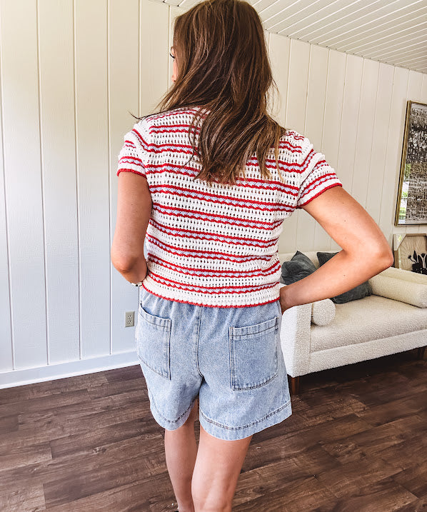 Soft crochet knit red, white and light blue striped short sleeved tie front sweater.