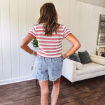 Thin, light wash denim skort with pointed hem and pockets.