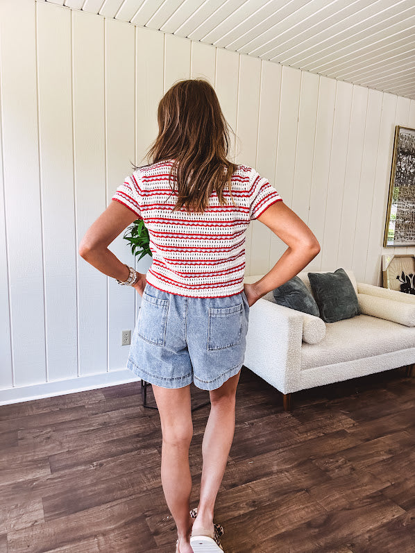 Thin, light wash denim skort with pointed hem and pockets.