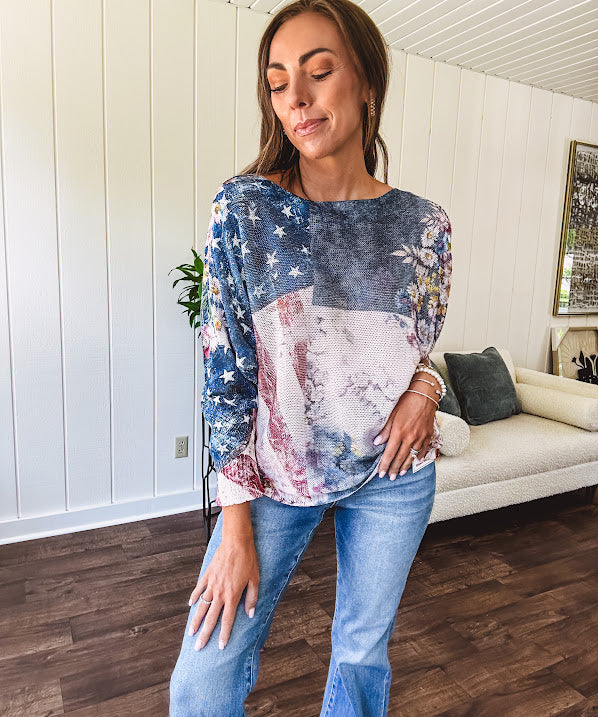 Made in Italy in muted navy, cream and berry with vintage florals and stars and stripes, long sleeved boat neck batwing sweater.