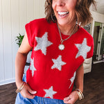 Bold red sweater vest with silver fuzzy stars throughout.