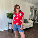 Bold red sweater vest with silver fuzzy stars throughout.