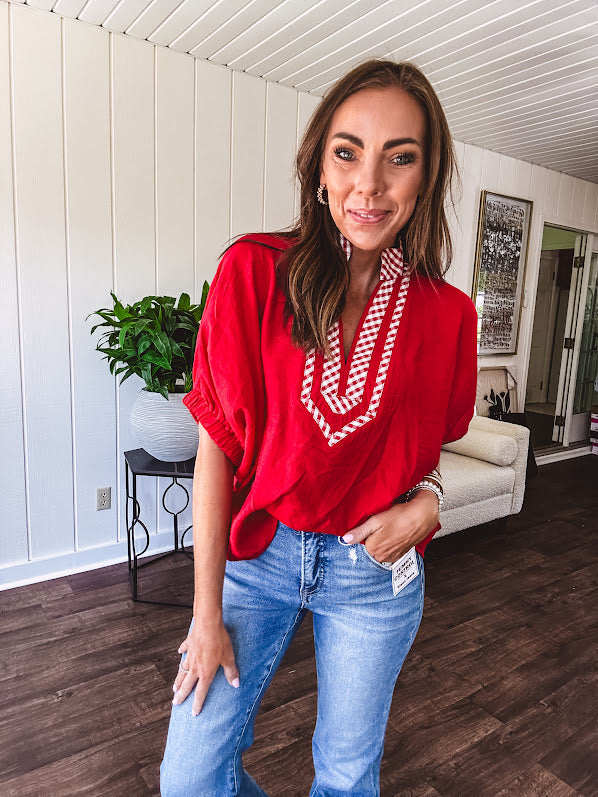 Cool red dolman style top with white and red gingham trim at the mock neck and yoke.